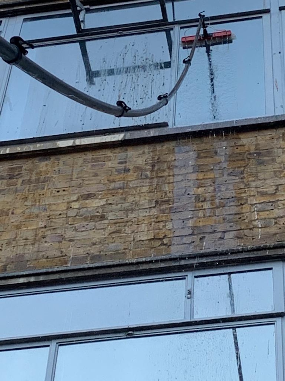 Commercial window cleaning with a water-fed brush in Barnes, SW13