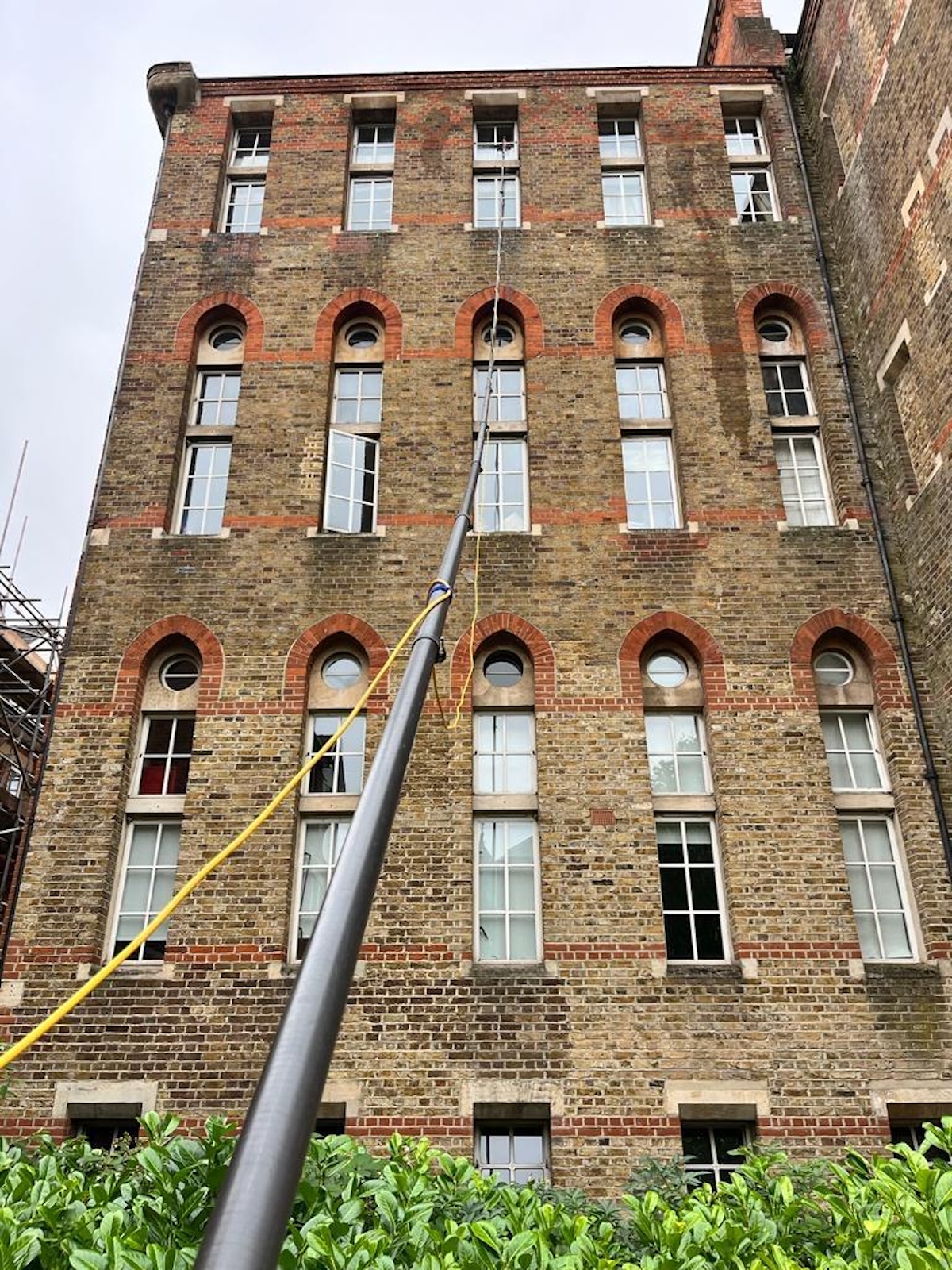 High-level window cleaning on a Victorian building in Barnes, SW13