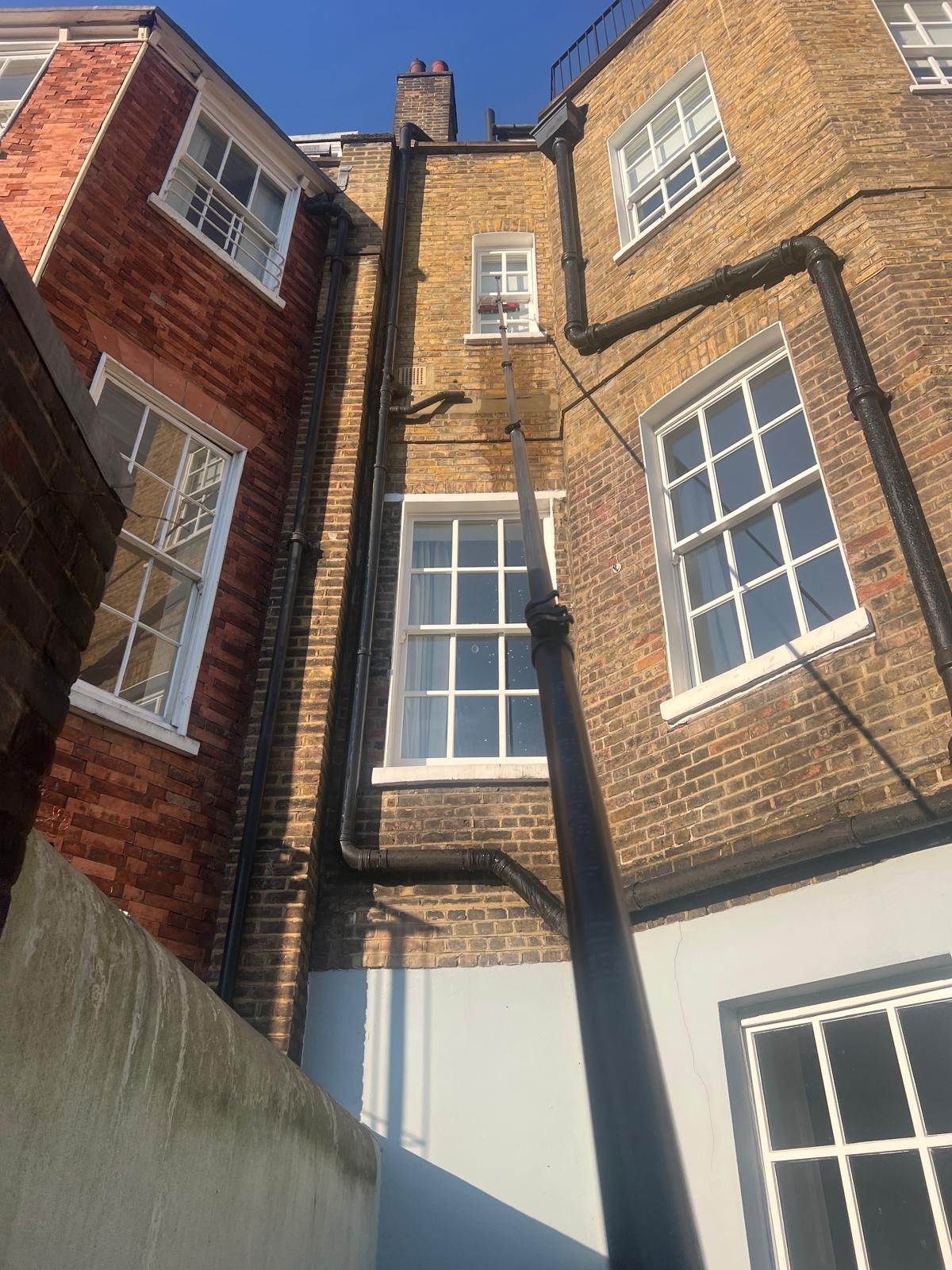 Sash window cleaning with a water-fed pole in Barnes, SW13